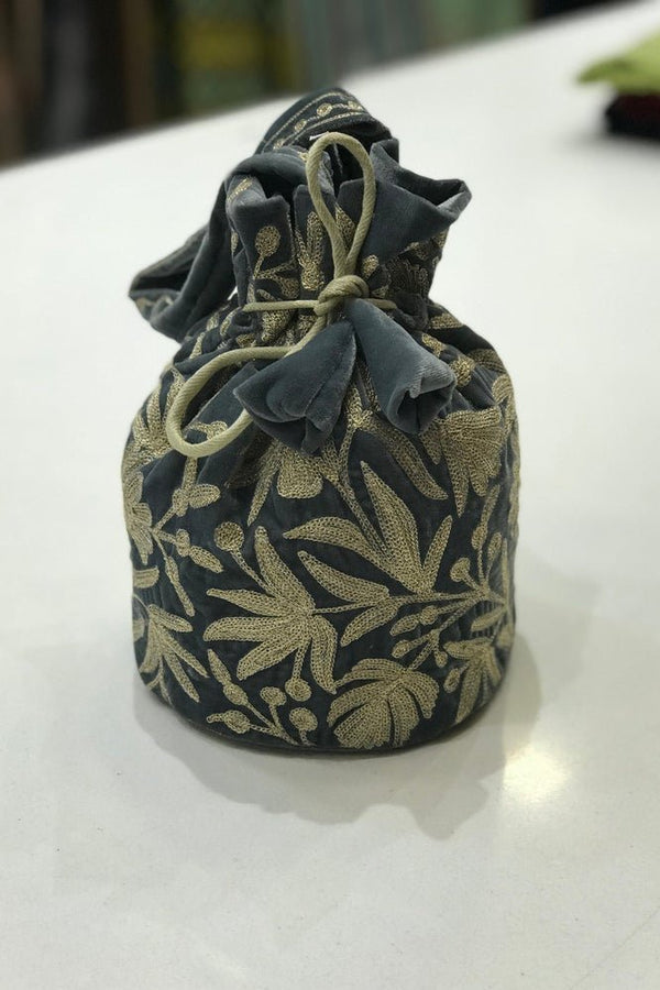 #Gray Decorative fabric pouch with floral pattern on a white surface