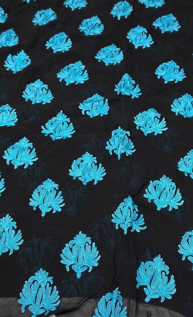Black fabric with blue floral patterns