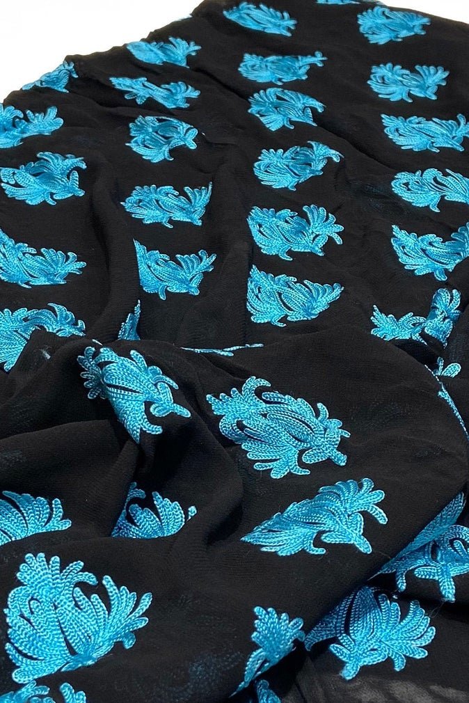 Black fabric with blue floral patterns