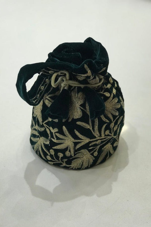 #BottleGreen Decorative bottle green velvet bag with gold embroidery on a white background