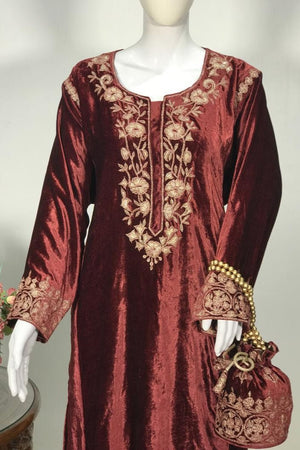Maroon embroidered dress with matching handbag on a mannequin against a neutral background