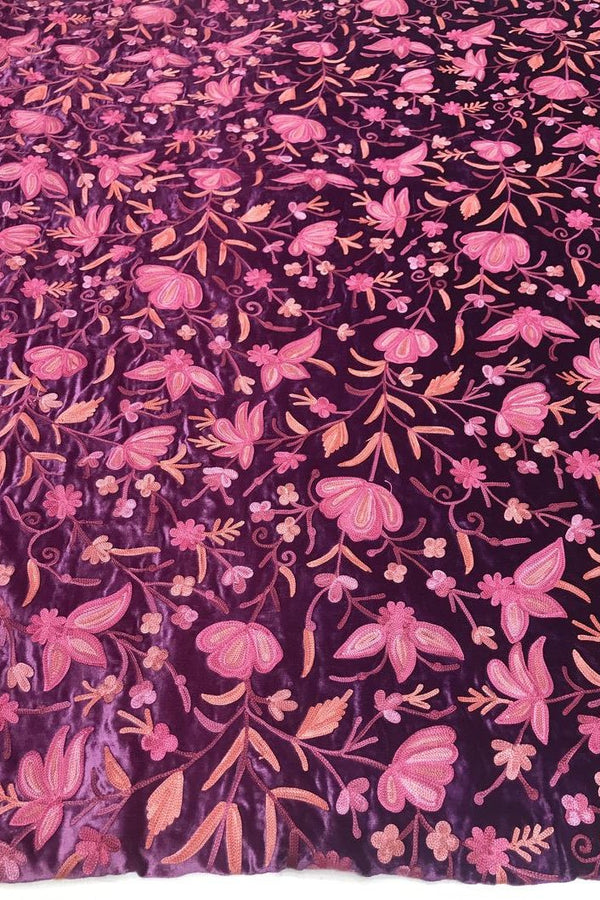 Floral patterned fabric with pink flowers on a dark background